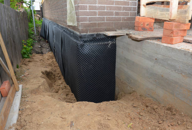 Happy homeowners after waterproofing job in Bloomington
